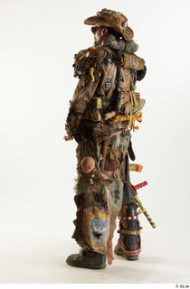 Ryan Miles in Junk Town Postapocalyptic Bobby Suit holding gun…